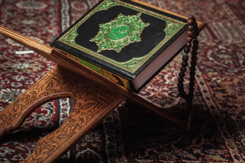 The Qur'an resting on a wooden stand